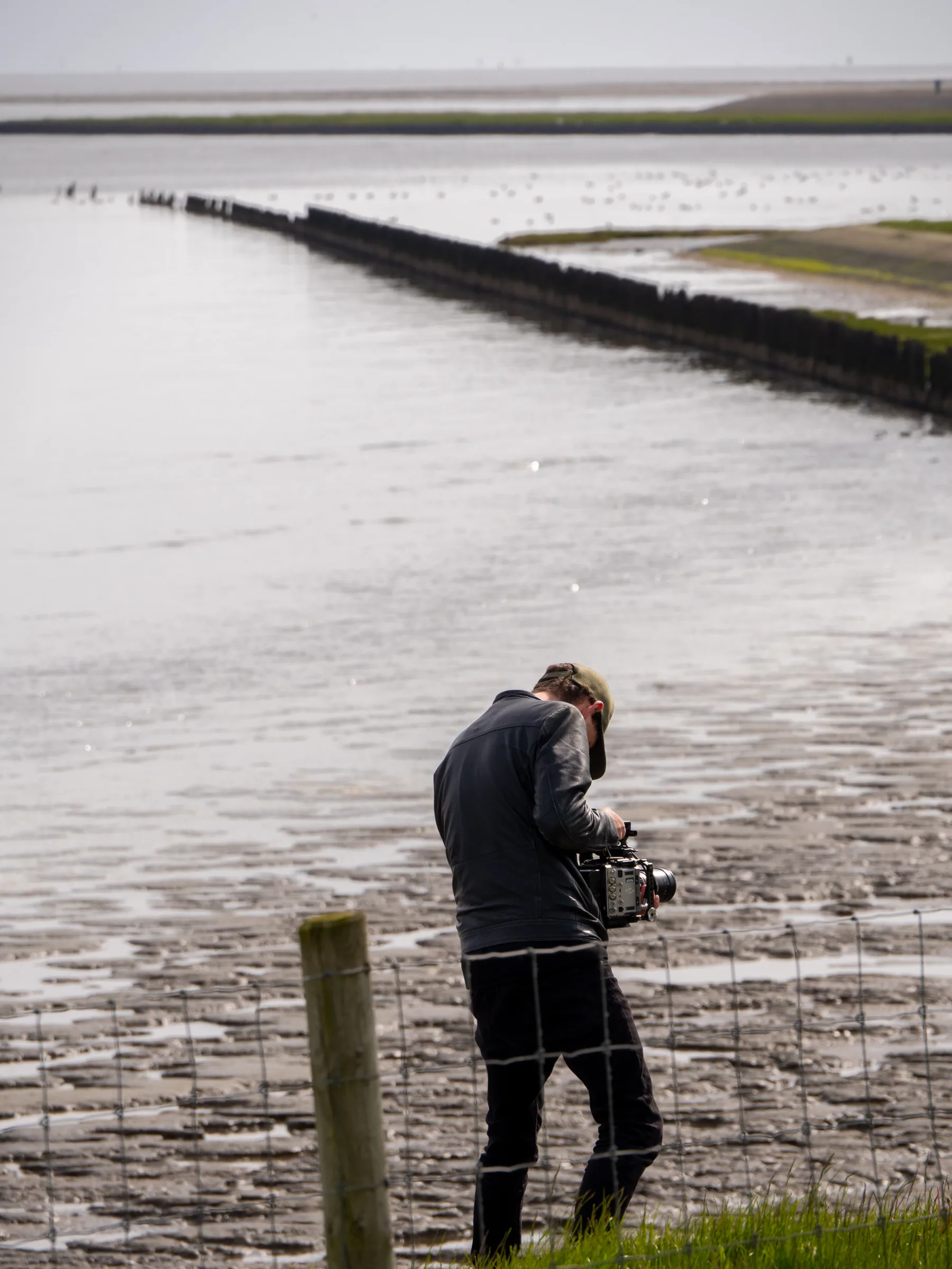 Cameraman aan de Waddenkust