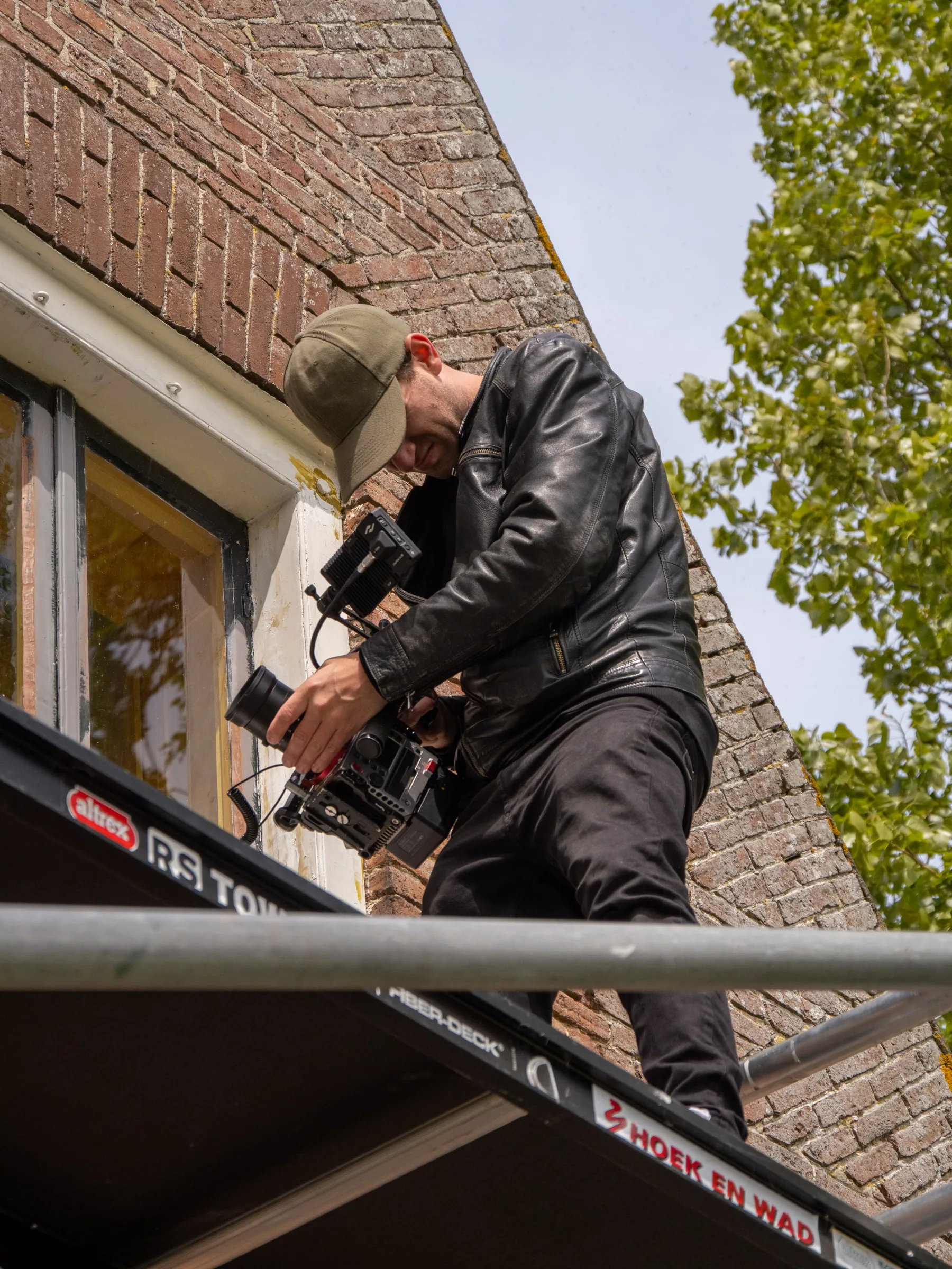 Camera op steiger · filmen schilderwerk